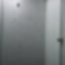 Close-up view of soap scum buildup on a glass shower door