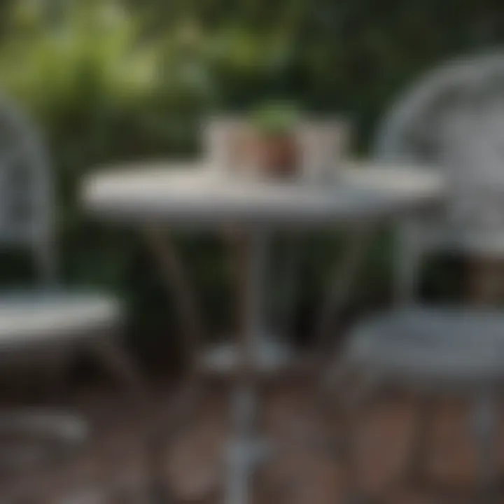 Close-up of intricate detailing on an aluminum bistro table and chairs