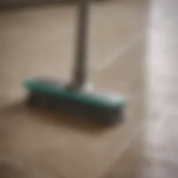 A meticulous cleaning brush working on grout lines