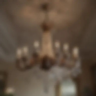 Antique chandelier hanging from a beautifully restored plaster ceiling