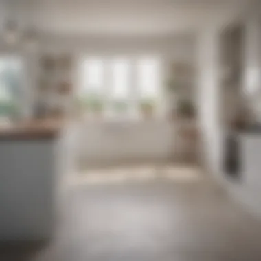 Dramatic view of a white kitchen under soft, ambient lighting at dusk.