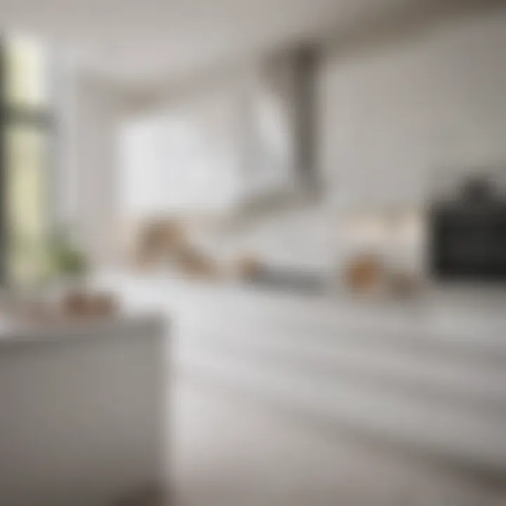 Bright and airy white kitchen featuring elegant cabinetry and white tiles.